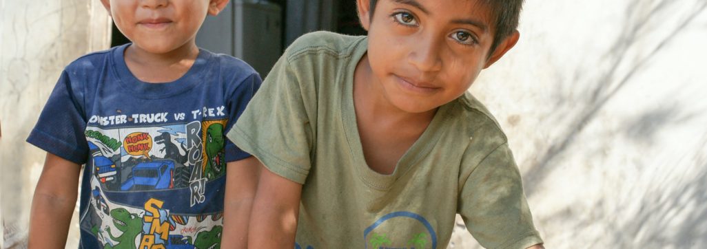two boy smiling during daytime