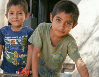 two boy smiling during daytime